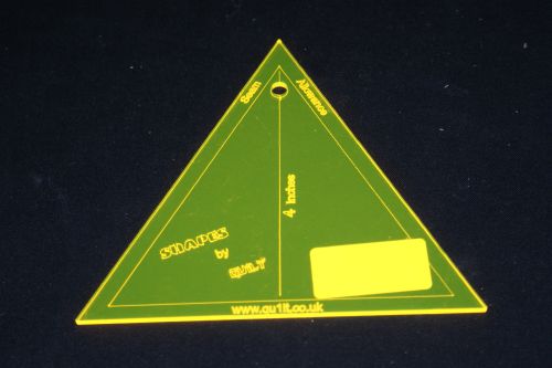 A 60 degree EQUAL TRIANGLE ACRYLIC TEMPLATE measuring 4 inches across the flat sides