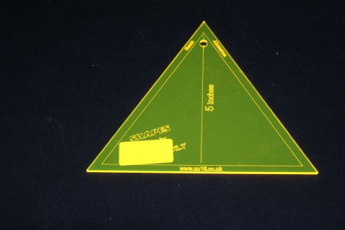 A 60 degree EQUAL TRIANGLE ACRYLIC TEMPLATE measuring 5 inches across the flat sides